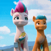 two ponies are standing next to each other and one has a pink mohawk