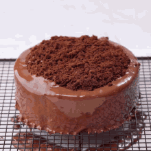 a chocolate cake with crumbs on top of it