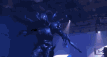 a person is standing in front of a camera with a light coming out of it
