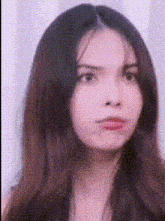 a close up of a woman 's face with a polka dot background