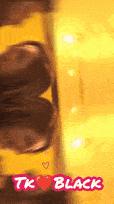 a yellow background with the words tk black