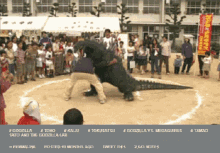 a screen shot of a sumo match between two men and a monster