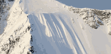 Skiier Falling Down Snowy Mountain GIF