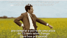 a man in a suit and tie is standing in a field