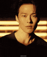 a close up of a man 's face with the words anniejiangki below it