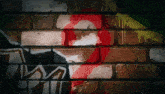 a brick wall with graffiti on it including a red circle