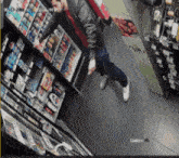 a man standing in front of a shelf with a pepsi advertisement on it