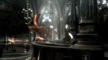 a dragon is flying in a dark room with a statue in the background .