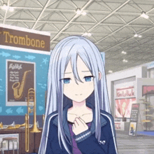 a girl stands in front of a trombone sign