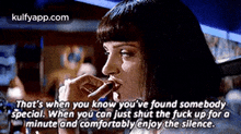 a woman is smoking a cigarette in a movie while a quote is written below her .