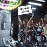 a group of women are dancing and holding a sign that says jhoaiah layag