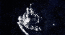 a black and white image of a statue of a man