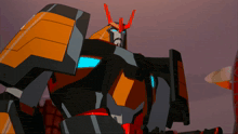 a black and orange robot with red horns and a blue light on his head