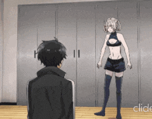 a man and a woman are standing next to each other and the woman is wearing a black bra