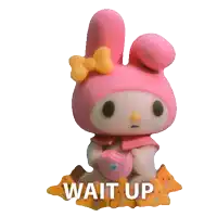 a pink stuffed animal with the words wait up written on it