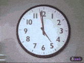 a clock on a wall shows that the time is 4:20