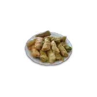 a white plate topped with stuffed cabbage leaves