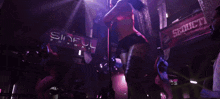 a sign that says sinful on it in a dark room