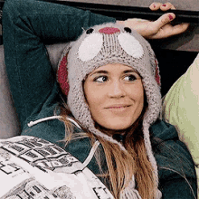 a woman wearing a hat that looks like a rabbit