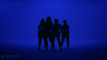 a group of people are standing in front of a blue background with the word gifsaespa on the bottom