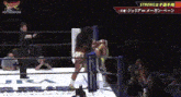 a woman is standing in a wrestling ring with a referee and a sign that says strong on it .