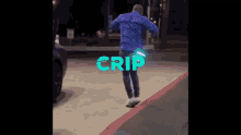 a man in a blue jacket and purple pants is dancing in a parking lot with the word crip on the ground .
