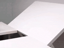 a close up of a white table with a hole in it .