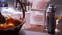 a bottle of monin syrup sits on a counter in a kitchen