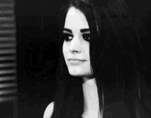 a black and white photo of a woman saying " this is my house "