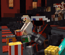 a group of minecraft characters are sitting in a theater holding boxes of popcorn