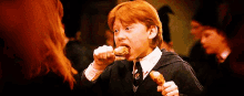Harry Potter GIF - Harry Potter Ron Weasley Eating Friend Chicken GIFs
