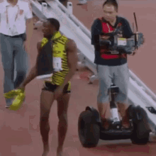 Usain Bolt Camera Man Fail GIF - Usa In Bolt Camera Man Fail GIFs
