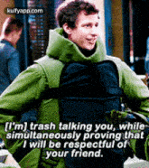 a man in a green jacket is talking to another man while wearing a bullet proof vest .
