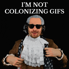 a man in a costume with the words " i 'm not colonizing gifs " behind him
