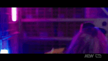 a puppet with purple hair is sitting in a car seat with a belt around its neck .