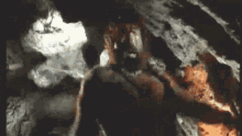 a painting of a cave with smoke coming out of the ceiling