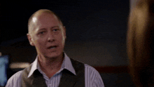 a man in a striped shirt and vest says " this is not an n "