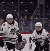 a hockey player wearing a number 3 jersey