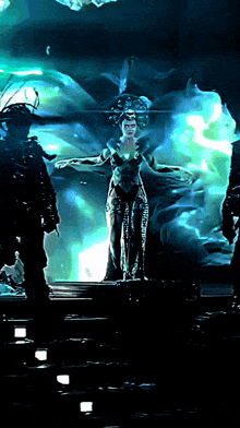 a painting of a woman standing in front of a glowing background