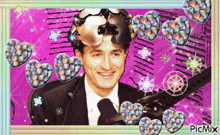 a picture of a man in a suit and tie is surrounded by hearts and a picmix logo