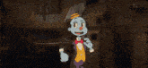 a cartoon character in a tuxedo and bow tie is pointing at the camera .