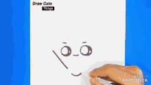 a person is drawing a face with a marker on a piece of paper