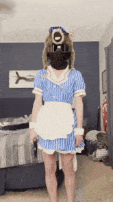 a person in a maid costume is wearing a mask and sunglasses