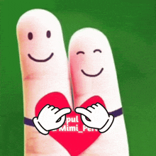 two fingers with faces drawn on them holding a red heart with the words pul mimi pen