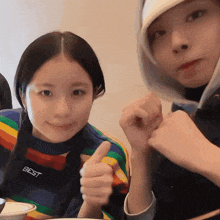 a girl wearing a sweater that says best on it