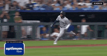 a baseball player for the new york yankees is running on a baseball field