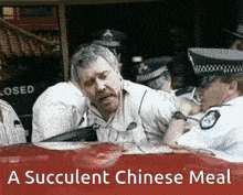 a succulent chinese meal is being advertised on a red car