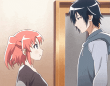 a man and a girl are standing next to each other and looking at each other