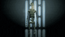 a robot is standing in front of a wall with a light on it