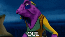 a purple and yellow cartoon character with the word oui on his hand .